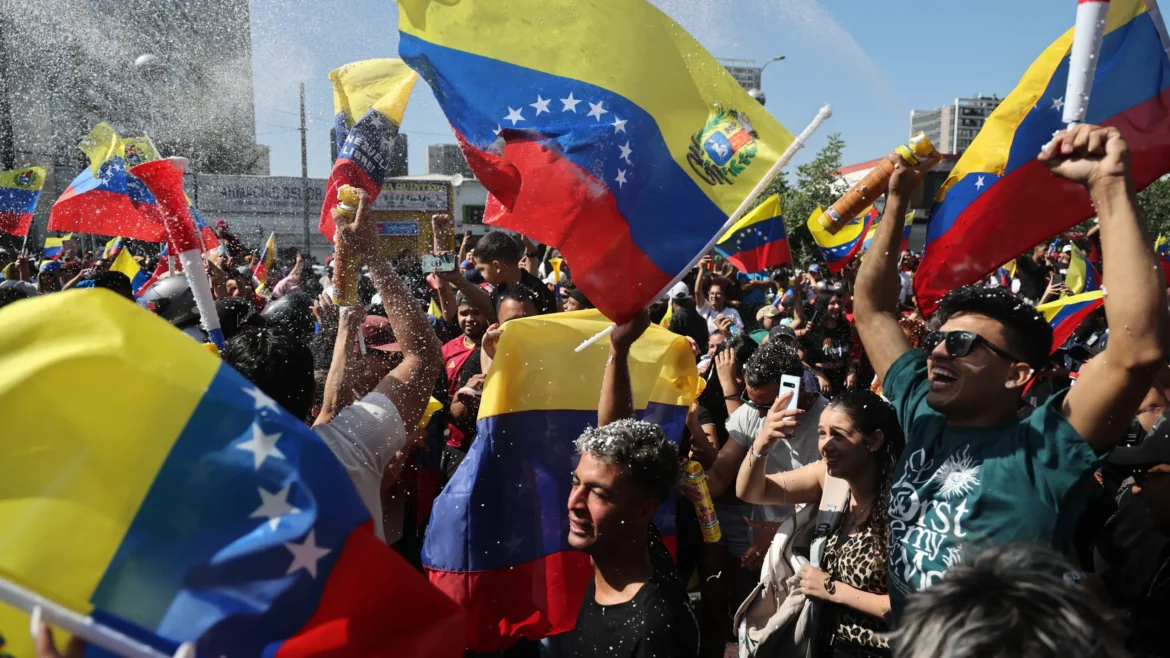 Venezuelan migrants celebrating in Santiago’s Parque Almagro after news from Caracas